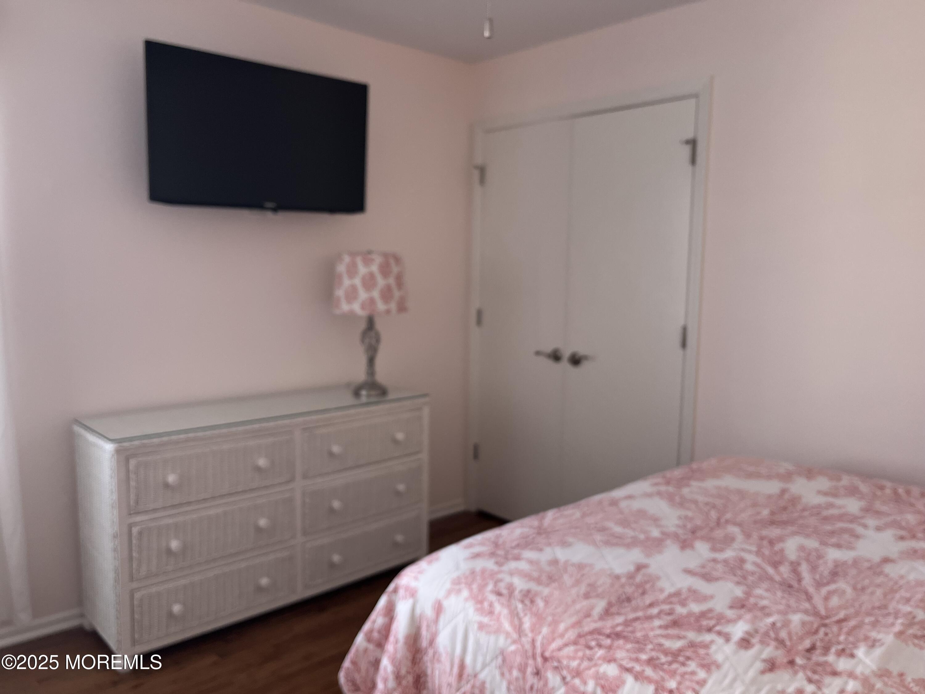 Undisclosed Address Bradley Beach, NJ 07720 - Photo 9 of 13 a bedroom with a bed and a flat screen tv