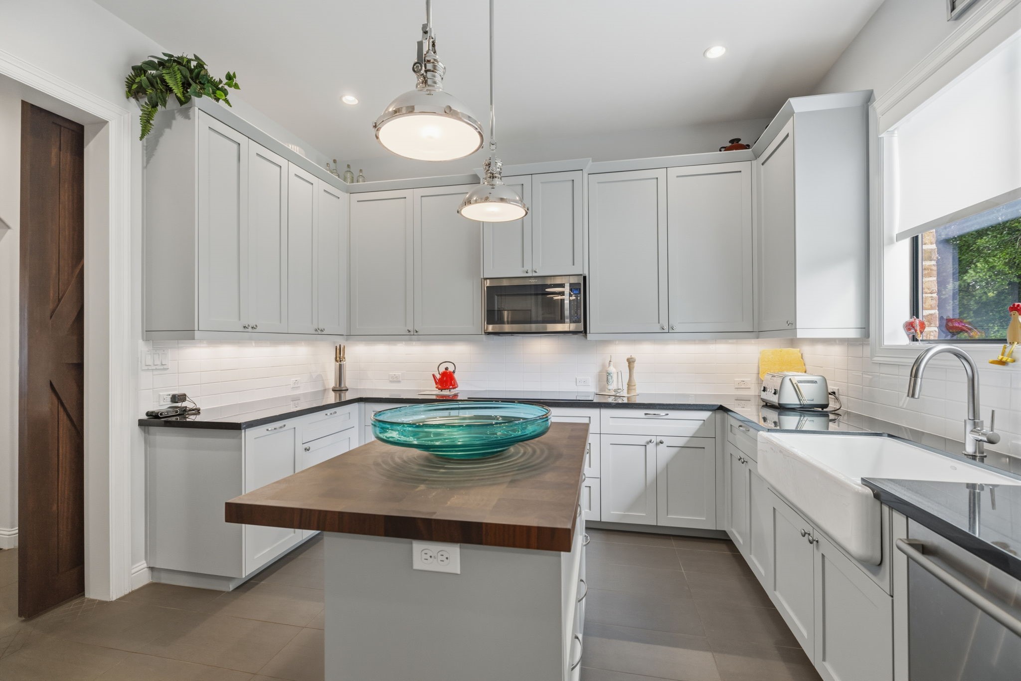 6918 Comanche Bend Montgomery, TX 77316 - Photo 29 of 50 No detail left unthought of! This space could serve as your very own “dirty kitchen,” perfectly tucked away behind custom barn doors while still offering exceptional function, storage, and flexibility.