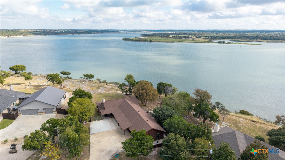 an aerial view of a house with a lake view
