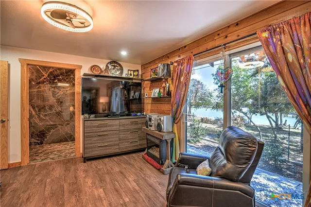 a view of hallway with furniture and a window
