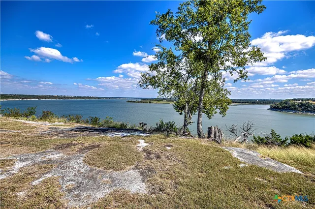 a view of a lake with sunset