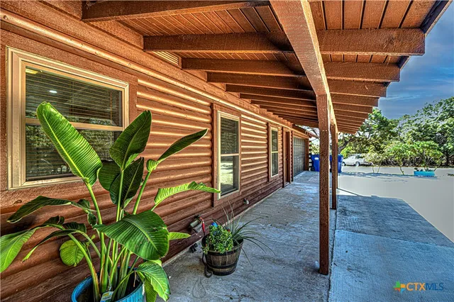a view of a porch with seating space