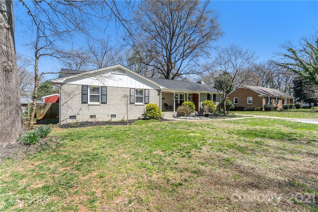 4235 Sudbury Road Charlotte, NC 28205 - Photo 1 of 29 a front view of a house with garden