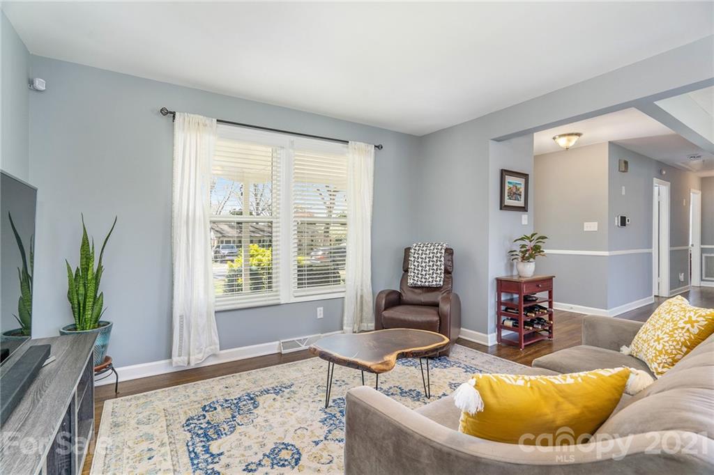 4235 Sudbury Road Charlotte, NC 28205 - Photo 12 of 29 a living room with furniture and a window
