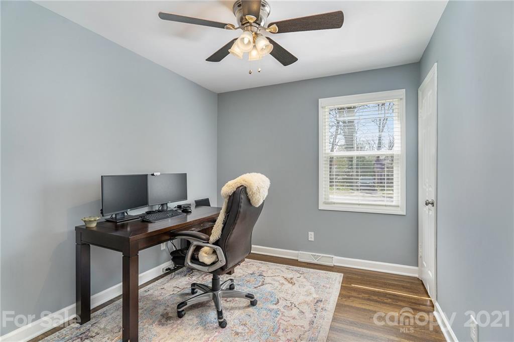 4235 Sudbury Road Charlotte, NC 28205 - Photo 18 of 29 a view of a workspace with furniture and a window