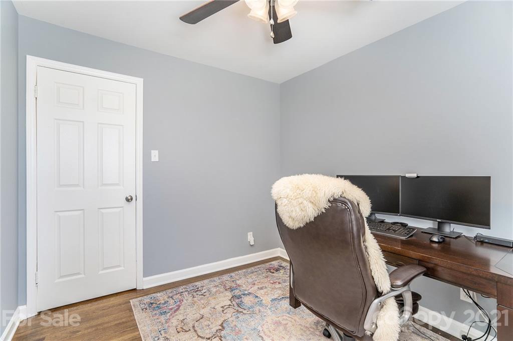 4235 Sudbury Road Charlotte, NC 28205 - Photo 19 of 29 a workspace with furniture and wooden floor