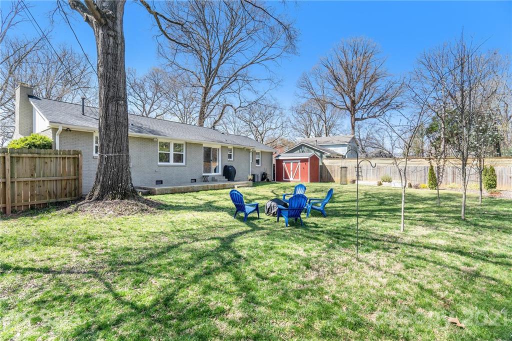 4235 Sudbury Road Charlotte, NC 28205 - Photo 28 of 29 a view of a house with backyard and sitting area