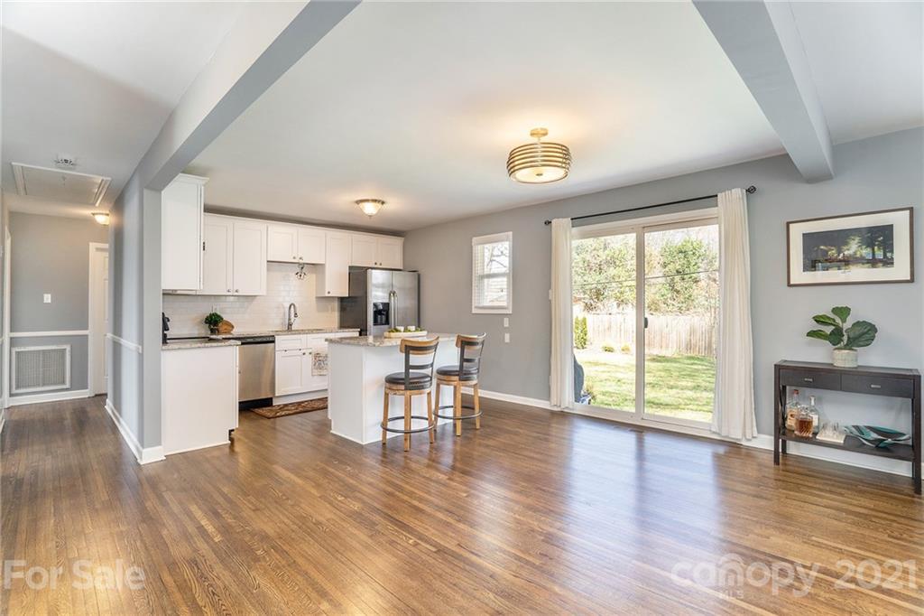 4235 Sudbury Road Charlotte, NC 28205 - Photo 4 of 29 a view of kitchen with cabinets and wooden floor