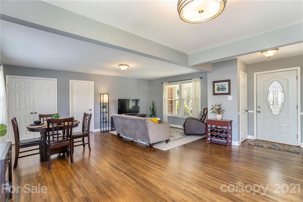 4235 Sudbury Road Charlotte, NC 28205 - Photo 9 of 29 a living room with furniture and a wooden floor