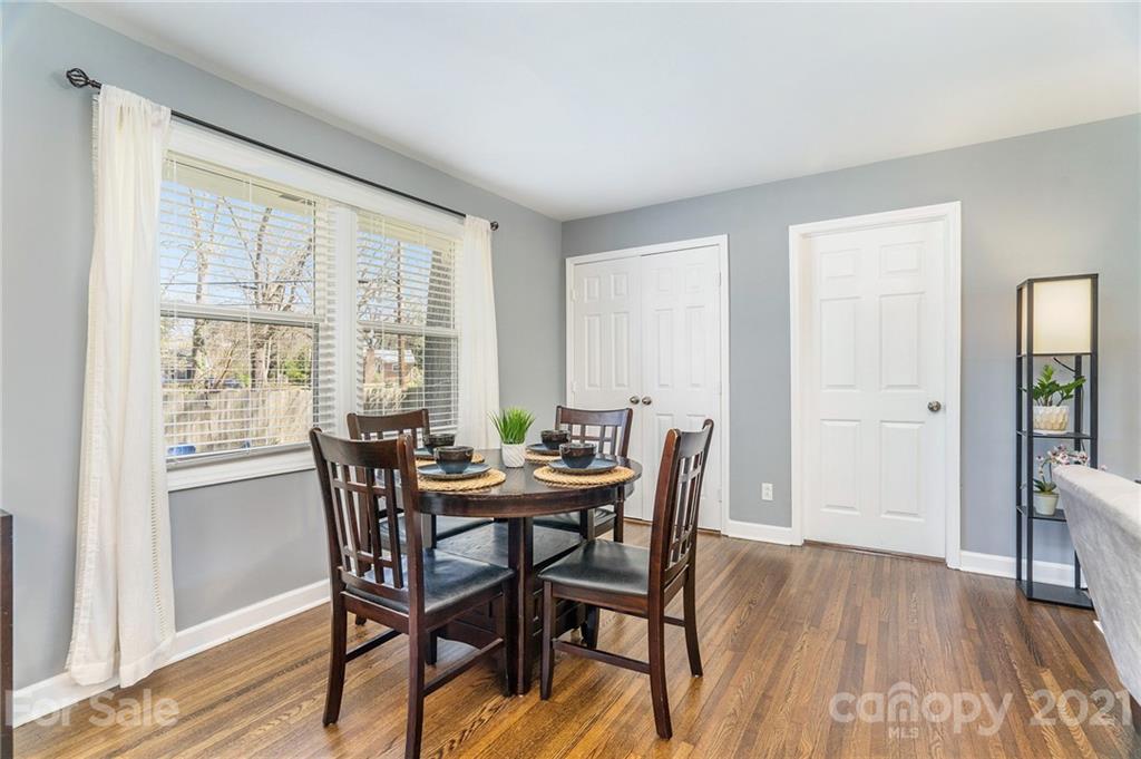 4235 Sudbury Road Charlotte, NC 28205 - Photo 10 of 29 a view of a dining room with furniture and wooden floor