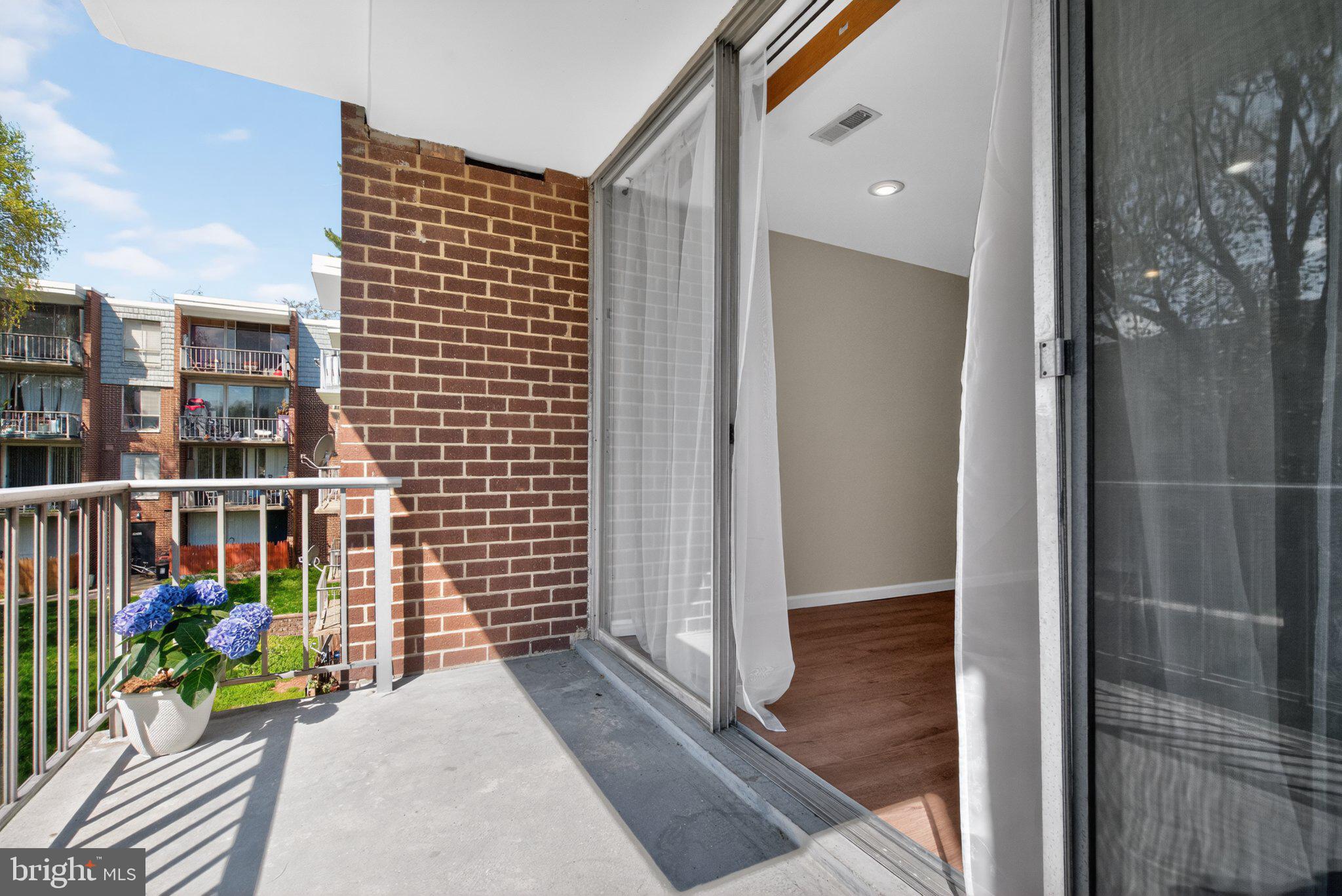 3932 Bel Pre Road, Unit 39326 Silver Spring, MD 20906 - Photo 13 of 20 Sunny balcony with garden views.