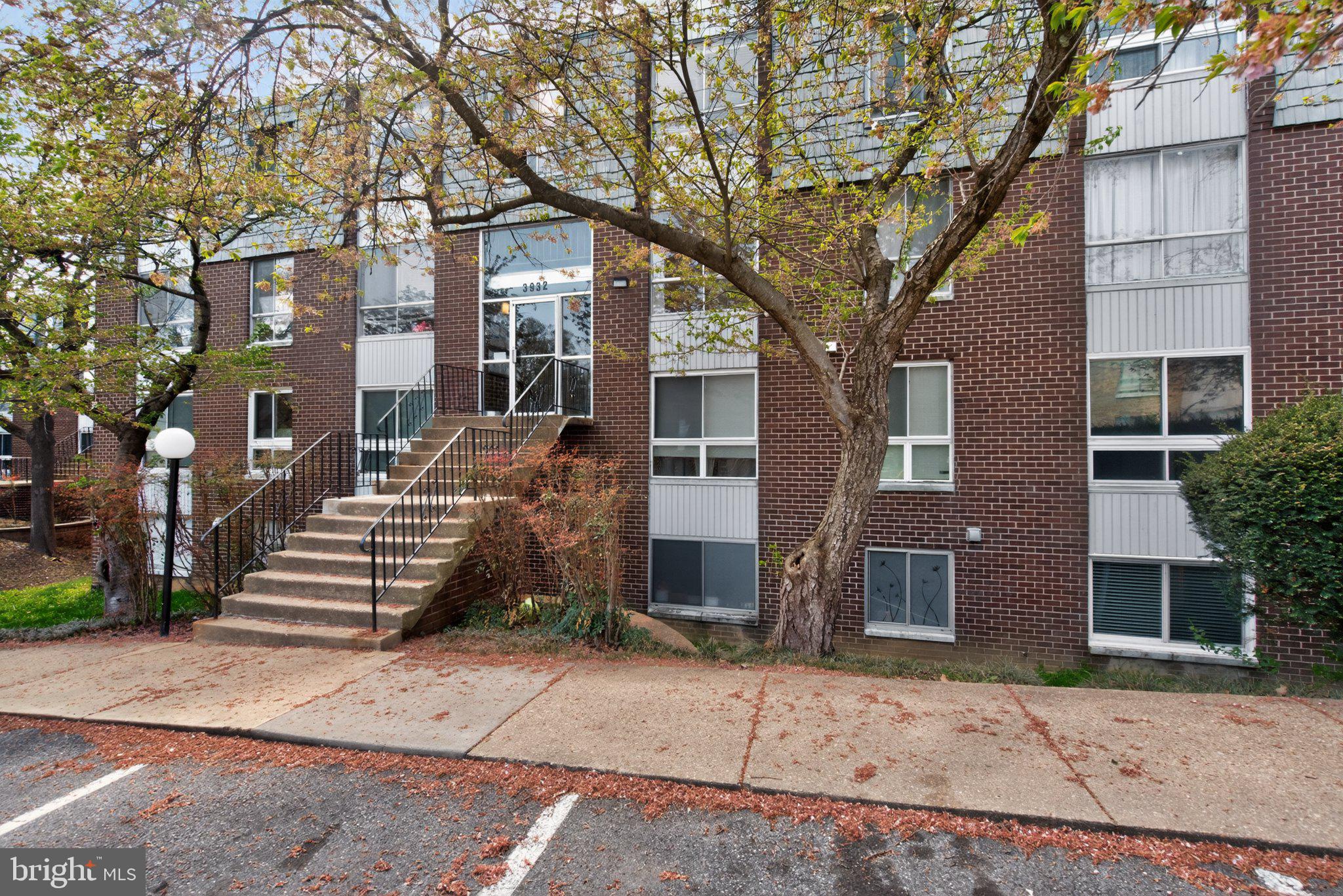 3932 Bel Pre Road, Unit 39326 Silver Spring, MD 20906 - Photo 16 of 20 Charming brick facade with lush greenery.