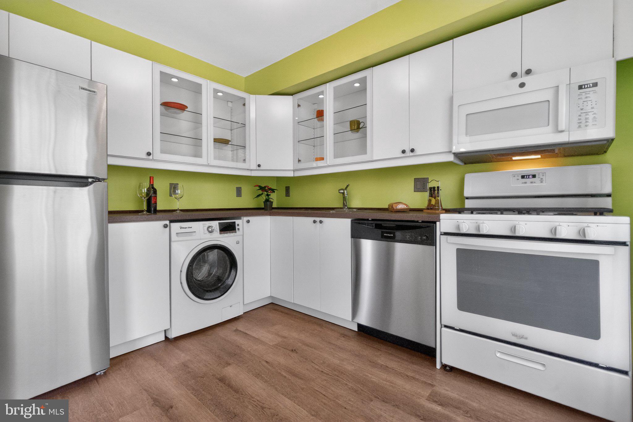 3932 Bel Pre Road, Unit 39326 Silver Spring, MD 20906 - Photo 6 of 20 Modern kitchen with vibrant accents.