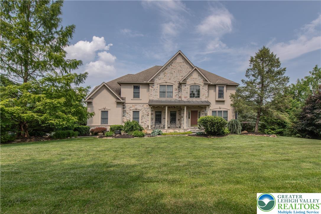 774 Lahr Road Nazareth, PA 18064 - Photo 1 of 58 a front view of a house with a garden