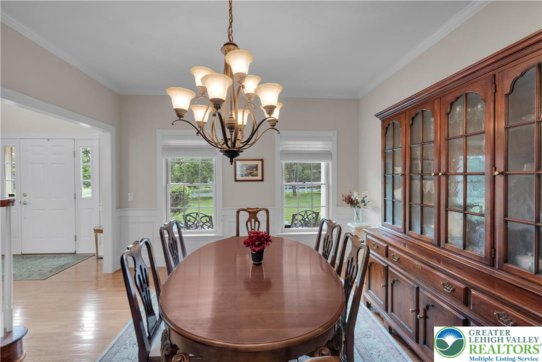 774 Lahr Road Nazareth, PA 18064 - Photo 22 of 58 a view of a dining room with furniture a chandelier and wooden floor