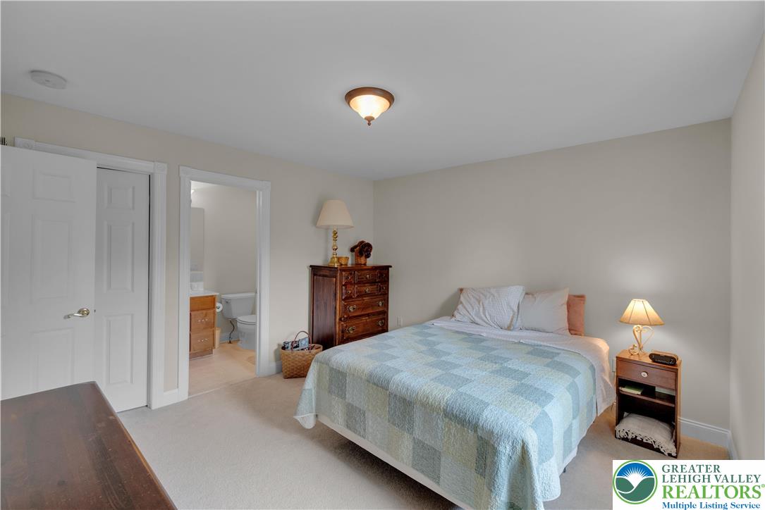 774 Lahr Road Nazareth, PA 18064 - Photo 30 of 58 a bedroom with a bed and a lamp