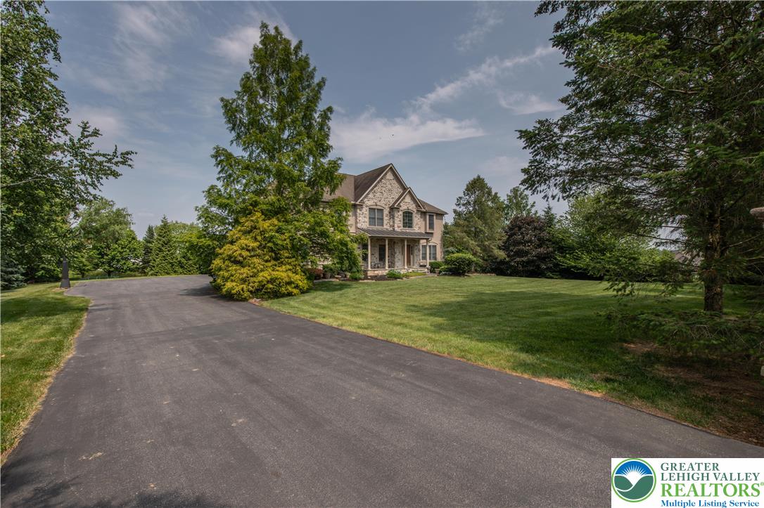 774 Lahr Road Nazareth, PA 18064 - Photo 3 of 58 a view of a house with a yard and potted plants