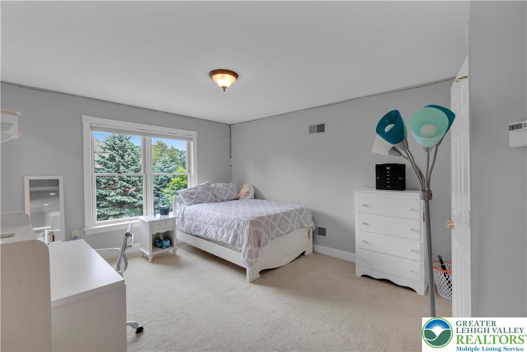 774 Lahr Road Nazareth, PA 18064 - Photo 33 of 58 a spacious bedroom with a bed and a large window