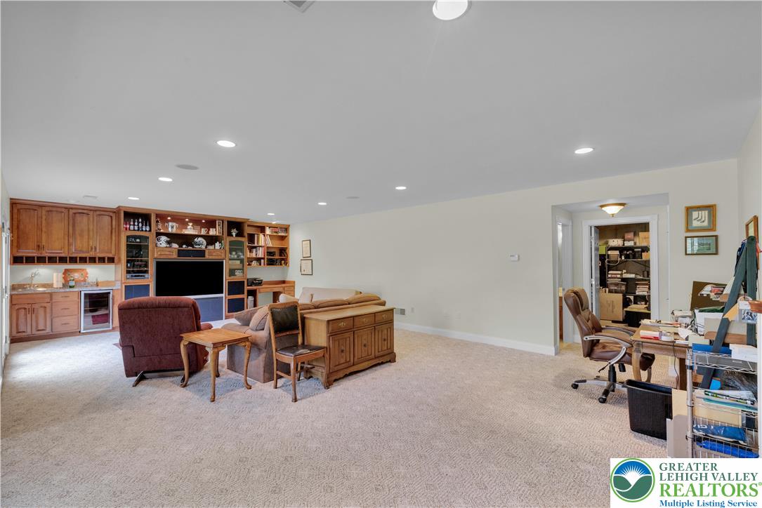 774 Lahr Road Nazareth, PA 18064 - Photo 40 of 58 a living room with furniture and a book shelf