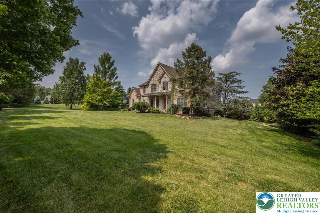 774 Lahr Road Nazareth, PA 18064 - Photo 4 of 58 a view of a big yard with large trees
