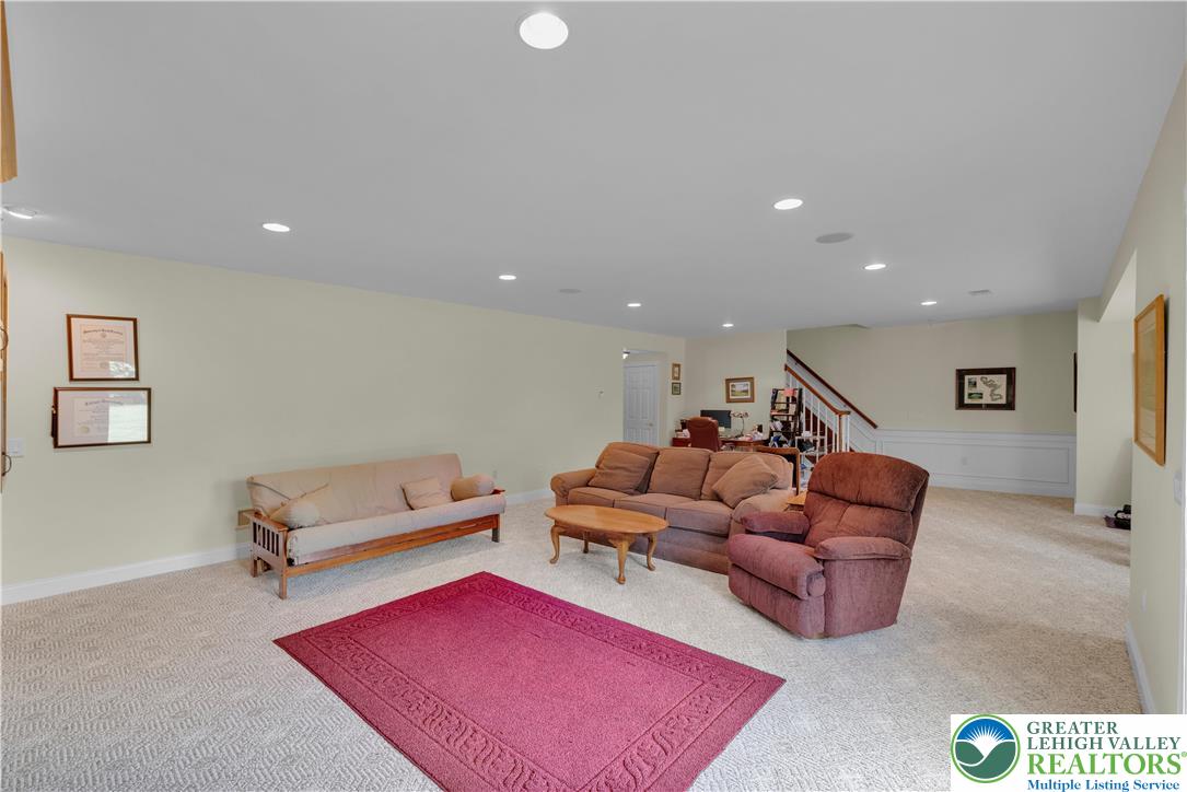 774 Lahr Road Nazareth, PA 18064 - Photo 42 of 58 a living room with furniture a rug and gym equipment
