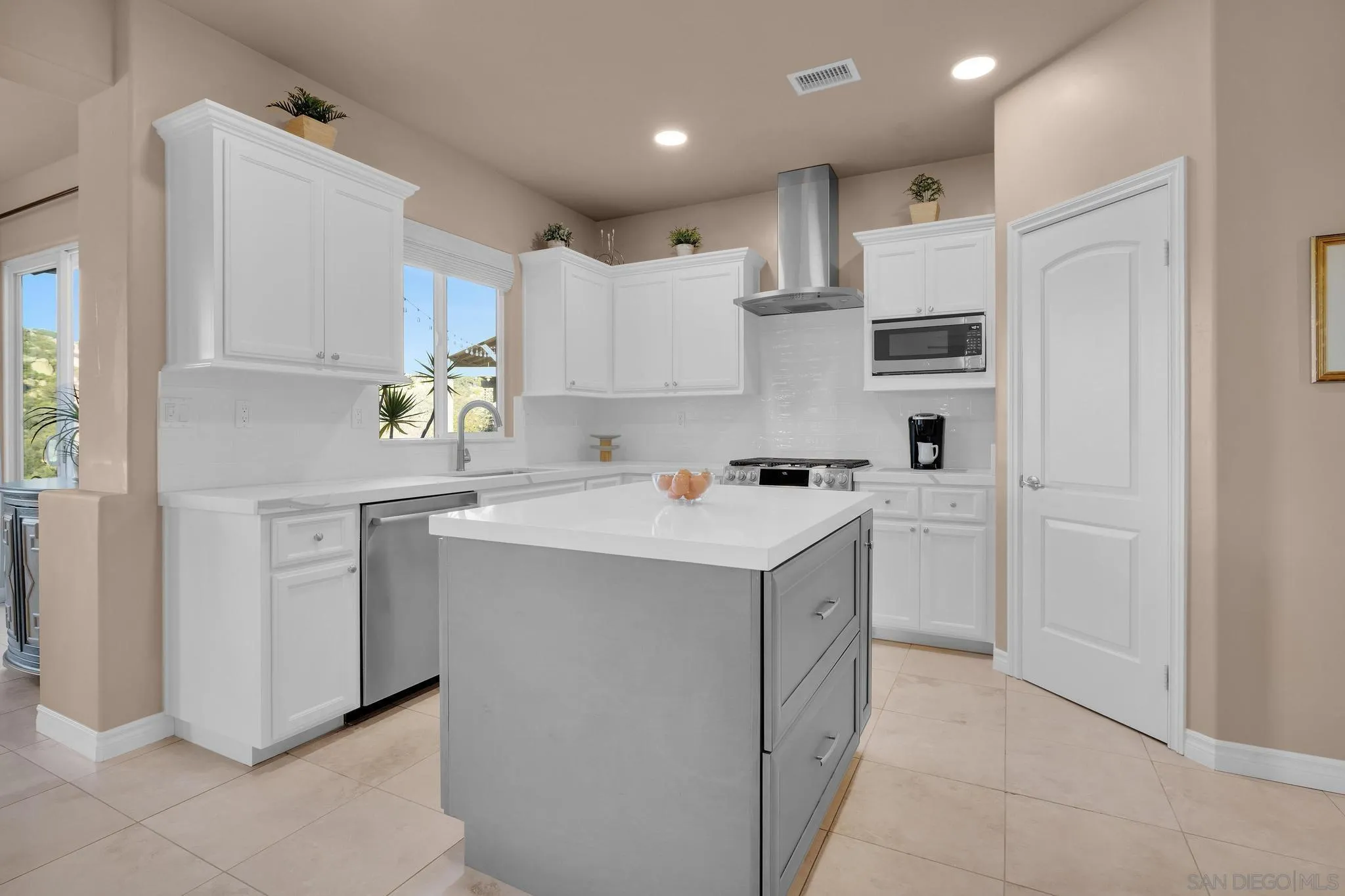 578 North Alpine Trail Road Alpine, CA 91901 - Photo 11 of 50 a kitchen with white cabinets and white appliances