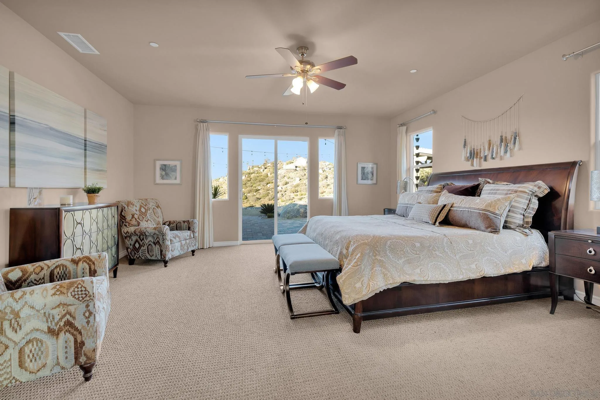 578 North Alpine Trail Road Alpine, CA 91901 - Photo 15 of 50 a spacious bedroom with a bed and a chandelier