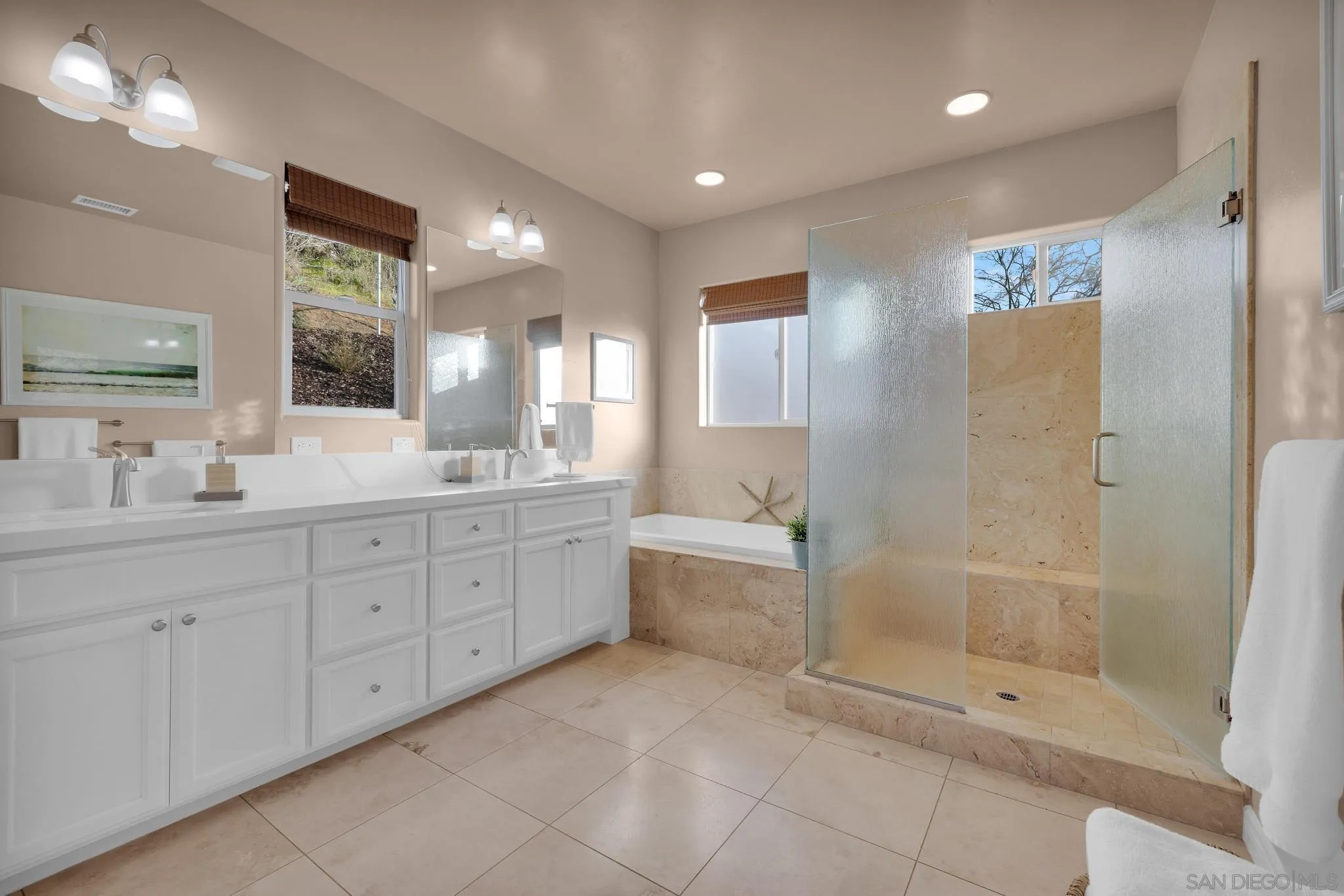 578 North Alpine Trail Road Alpine, CA 91901 - Photo 19 of 50 a spacious bathroom with a mirror a shower and vanity