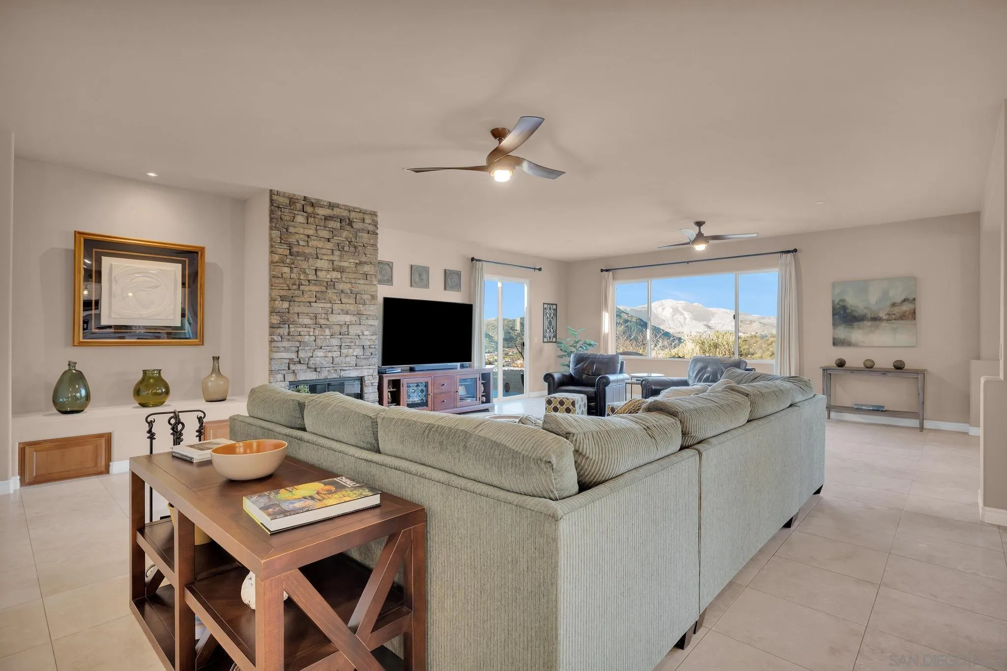 578 North Alpine Trail Road Alpine, CA 91901 - Photo 5 of 50 a living room with furniture a flat screen tv and a fireplace