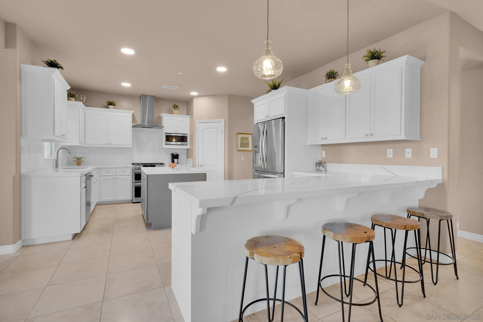 578 North Alpine Trail Road Alpine, CA 91901 - Photo 8 of 50 a kitchen with cabinets and chairs