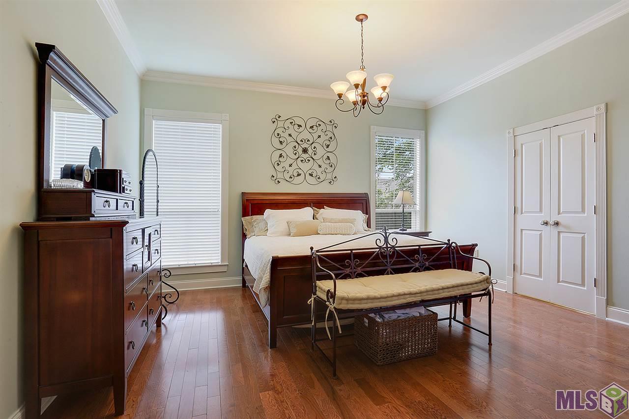 Master bedroom with wood floors
