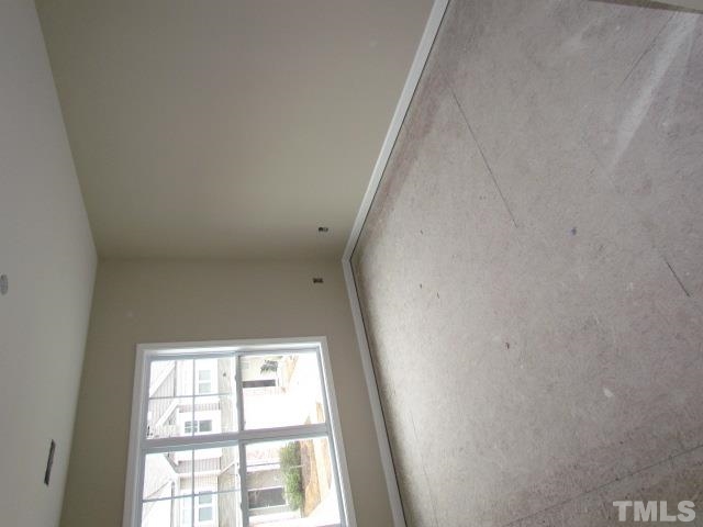 4623 Pat Reed Road Raleigh, NC 27616 - Photo 8 of 13 a view of an empty room with a window
