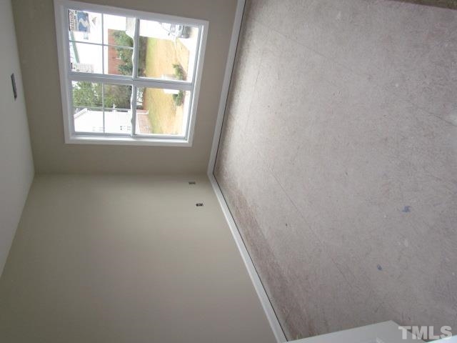 4623 Pat Reed Road Raleigh, NC 27616 - Photo 9 of 13 an empty room with a window