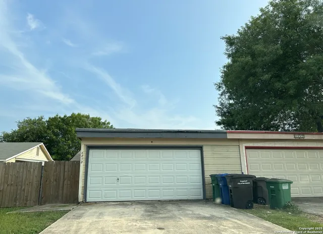 a front view of a house with garage