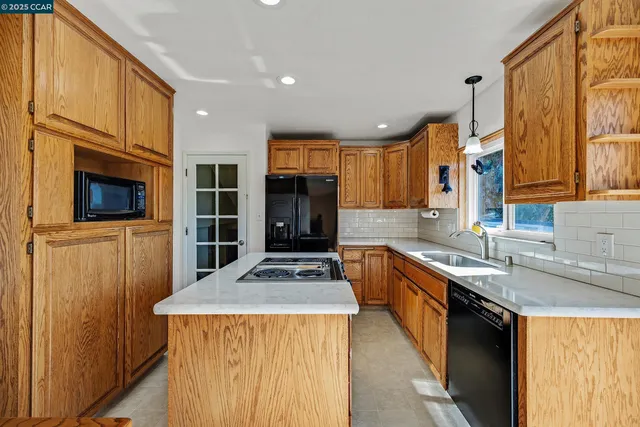 a kitchen with a stove and a sink