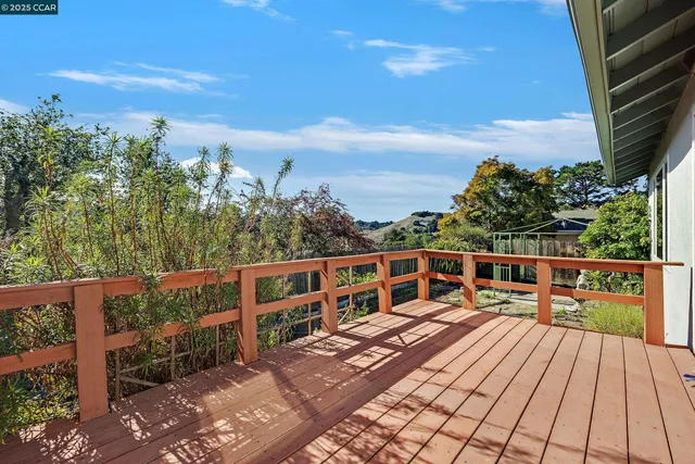 an aerial view of a house with yard