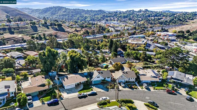 an aerial view of a house with a yard