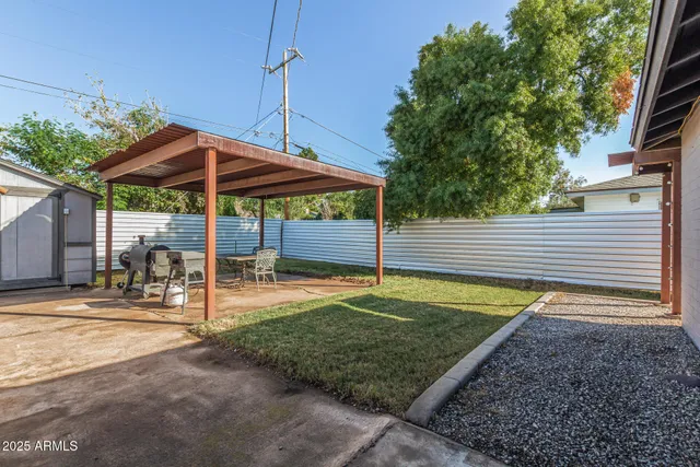 a view of a backyard with a patio