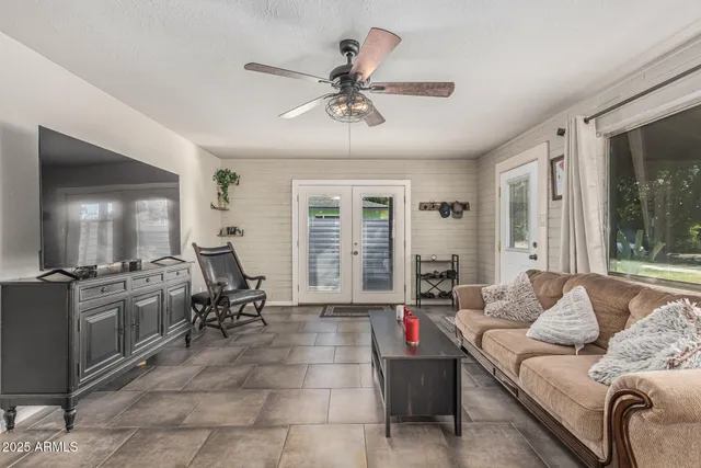 a living room with furniture and window