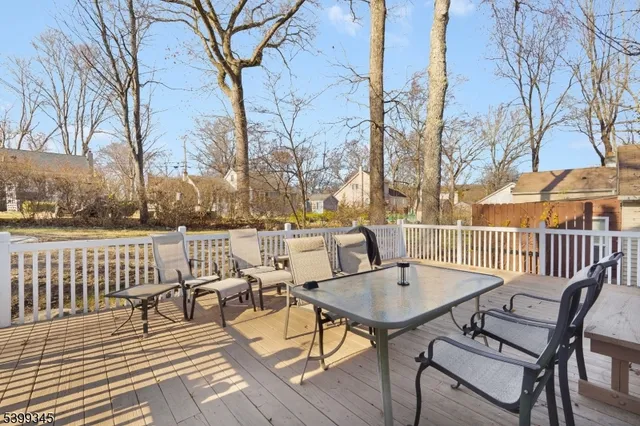a view of a chairs and table on the deck