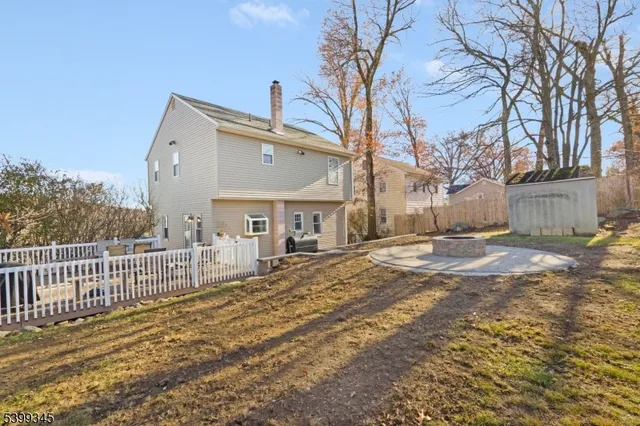 a view of a house with a yard covered with snow