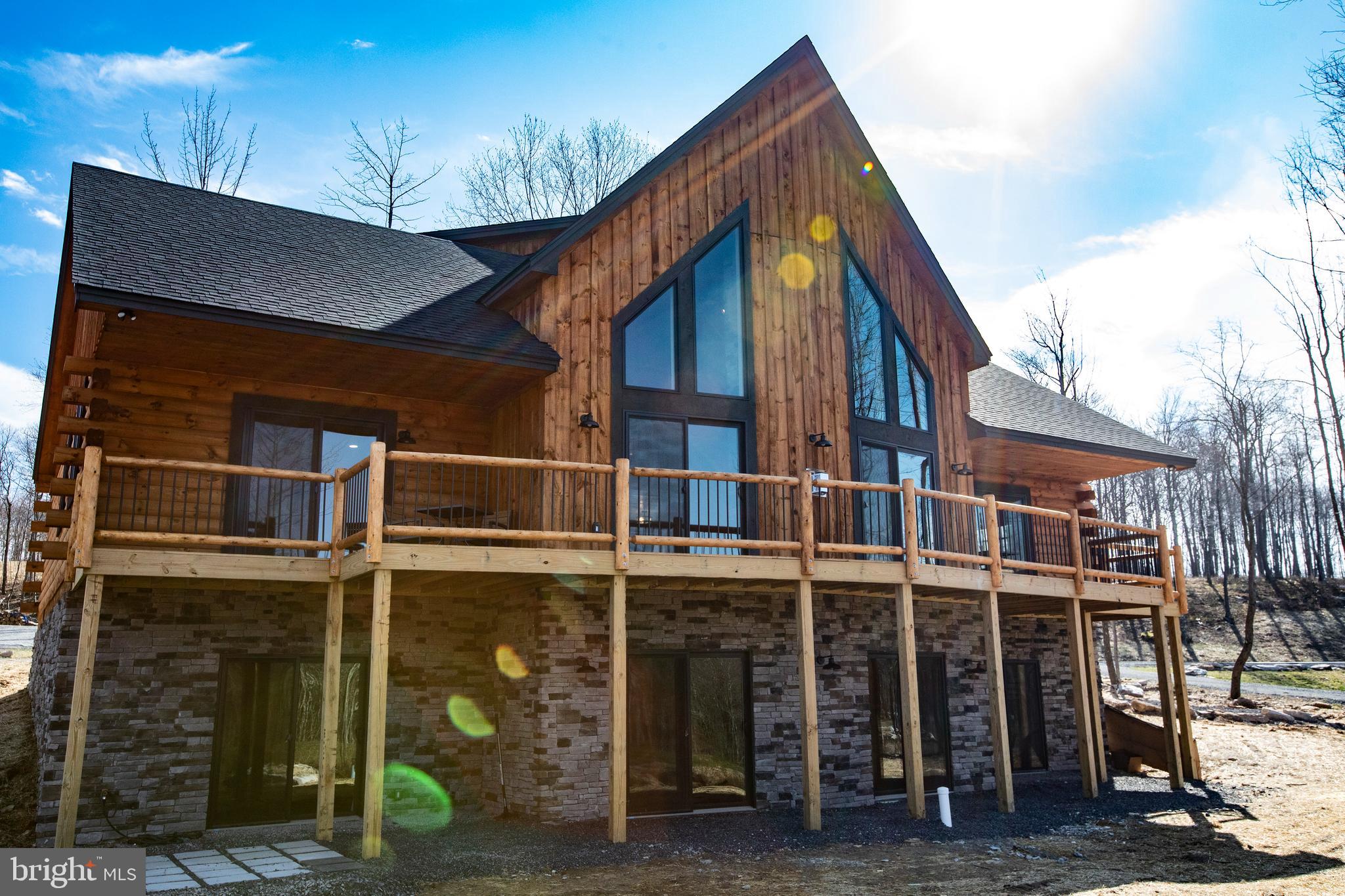 a view of a house with wooden fence