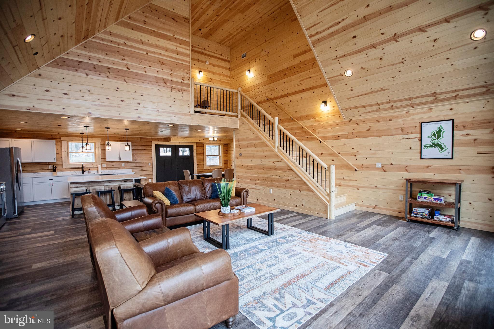 635 Biltmore Rdg Trail McHenry, MD 21541 - Photo 16 of 64 a living room with furniture and a wooden floor