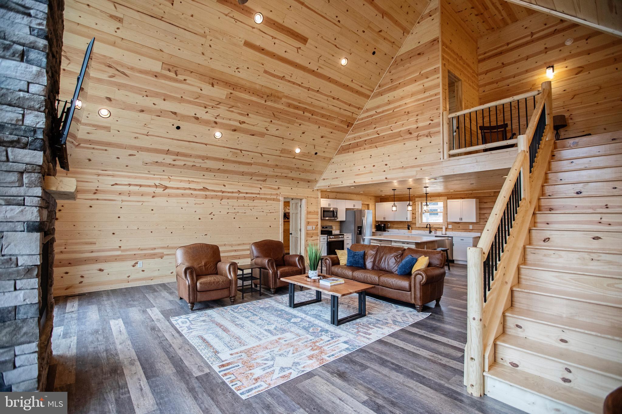 635 Biltmore Rdg Trail McHenry, MD 21541 - Photo 18 of 64 a living room with furniture and a wooden floor