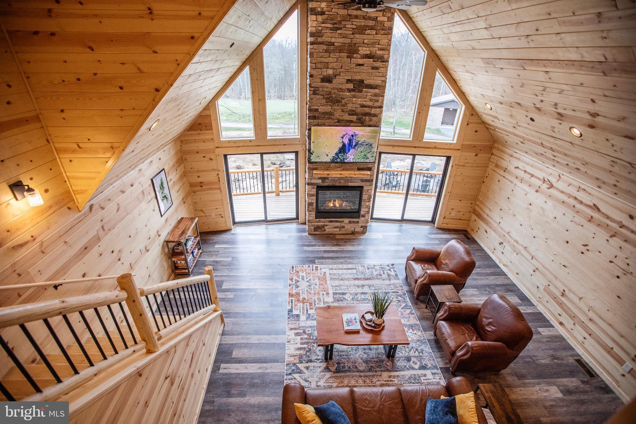 635 Biltmore Rdg Trail McHenry, MD 21541 - Photo 19 of 64 a living room with furniture and a fireplace