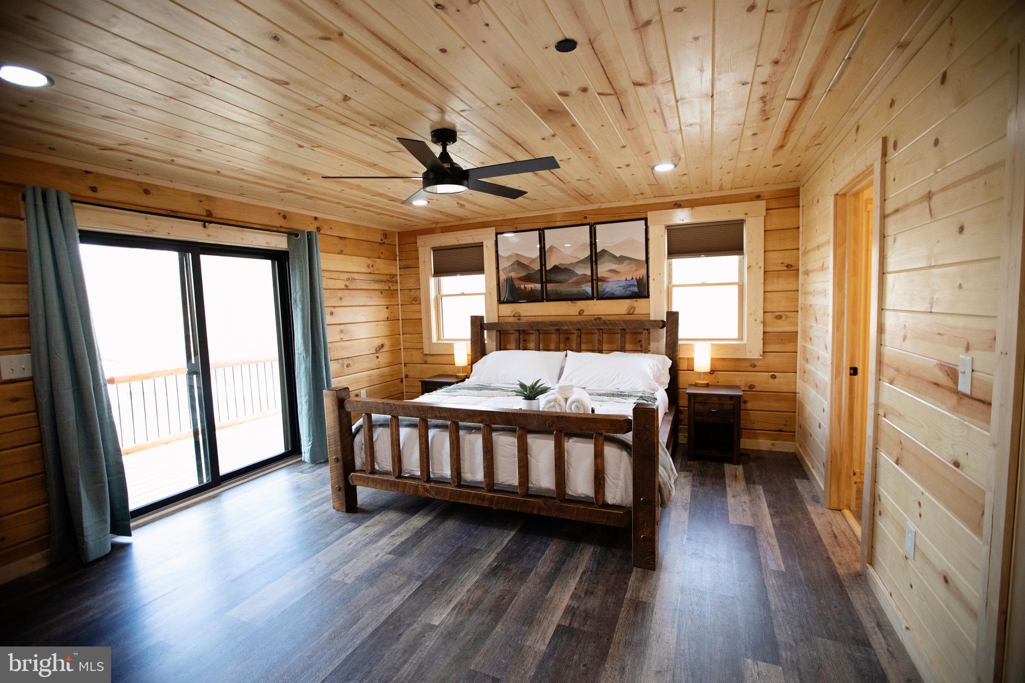 635 Biltmore Rdg Trail McHenry, MD 21541 - Photo 31 of 64 a bedroom with furniture wooden floor and a window
