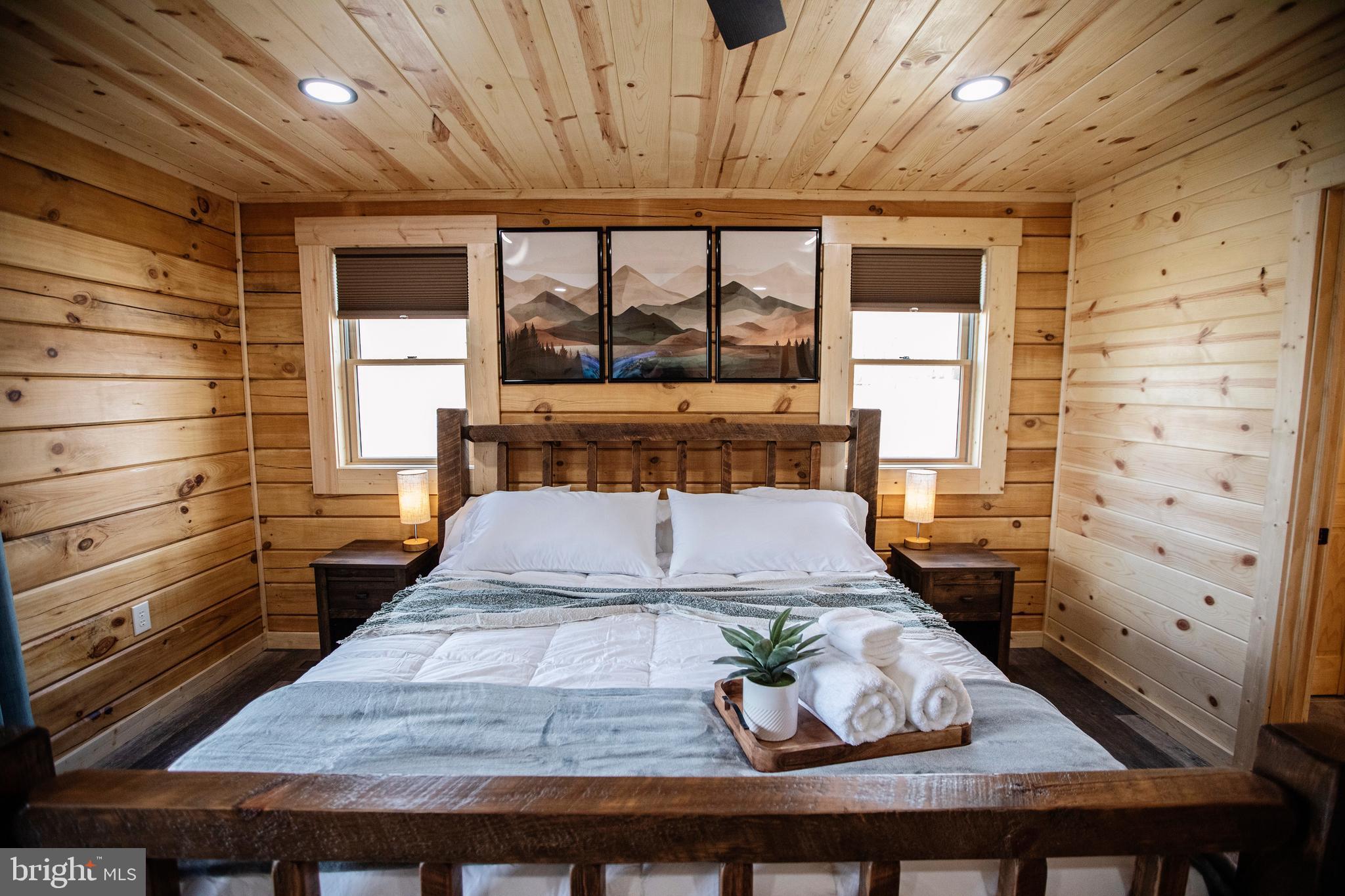 635 Biltmore Rdg Trail McHenry, MD 21541 - Photo 32 of 64 a bed sitting in a room next to a window