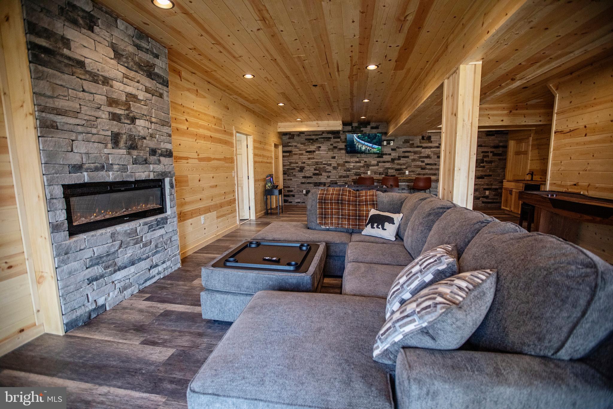 635 Biltmore Rdg Trail McHenry, MD 21541 - Photo 34 of 64 a living room with furniture and a fireplace