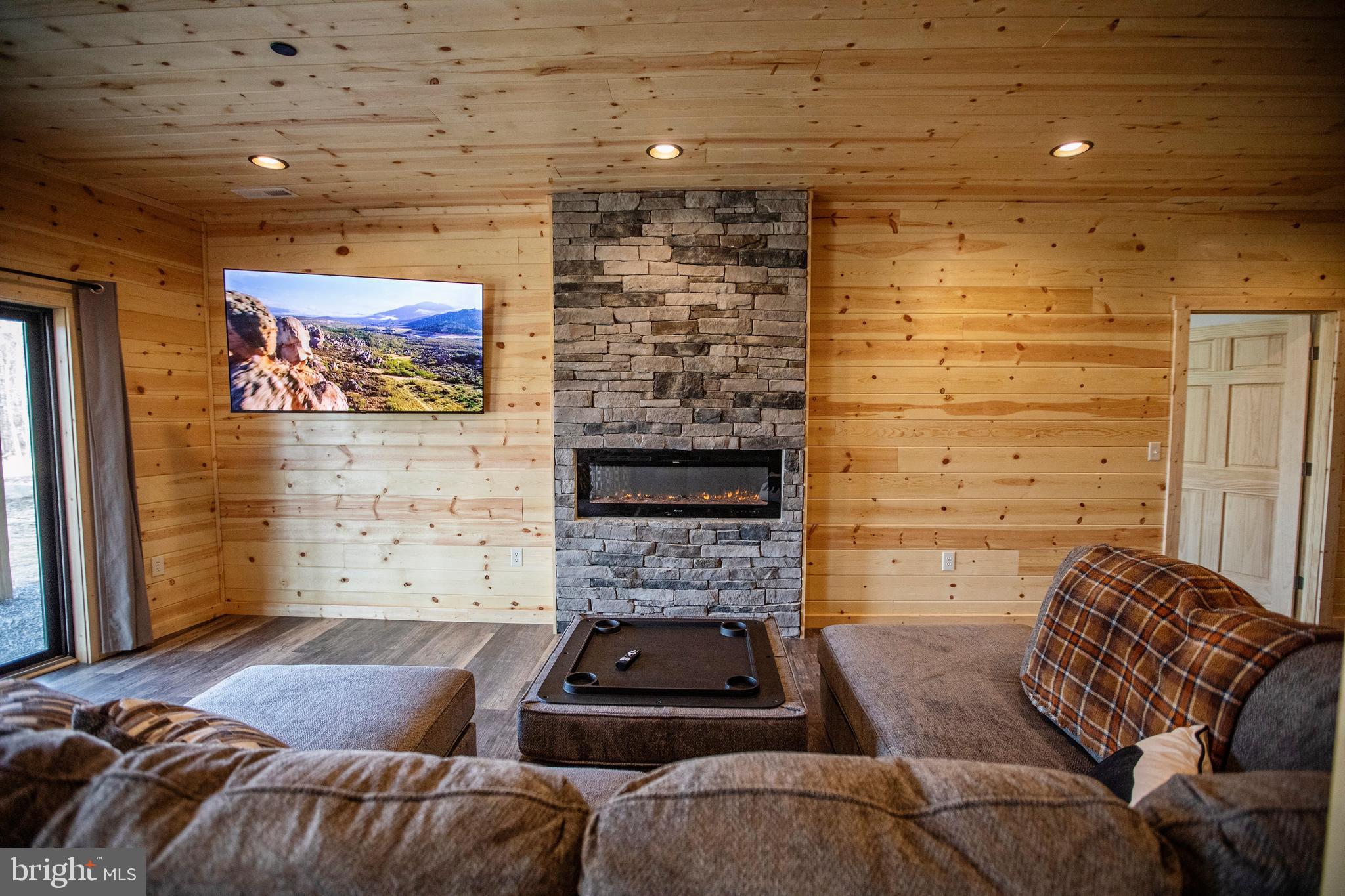 635 Biltmore Rdg Trail McHenry, MD 21541 - Photo 35 of 64 a living room with furniture and a fireplace