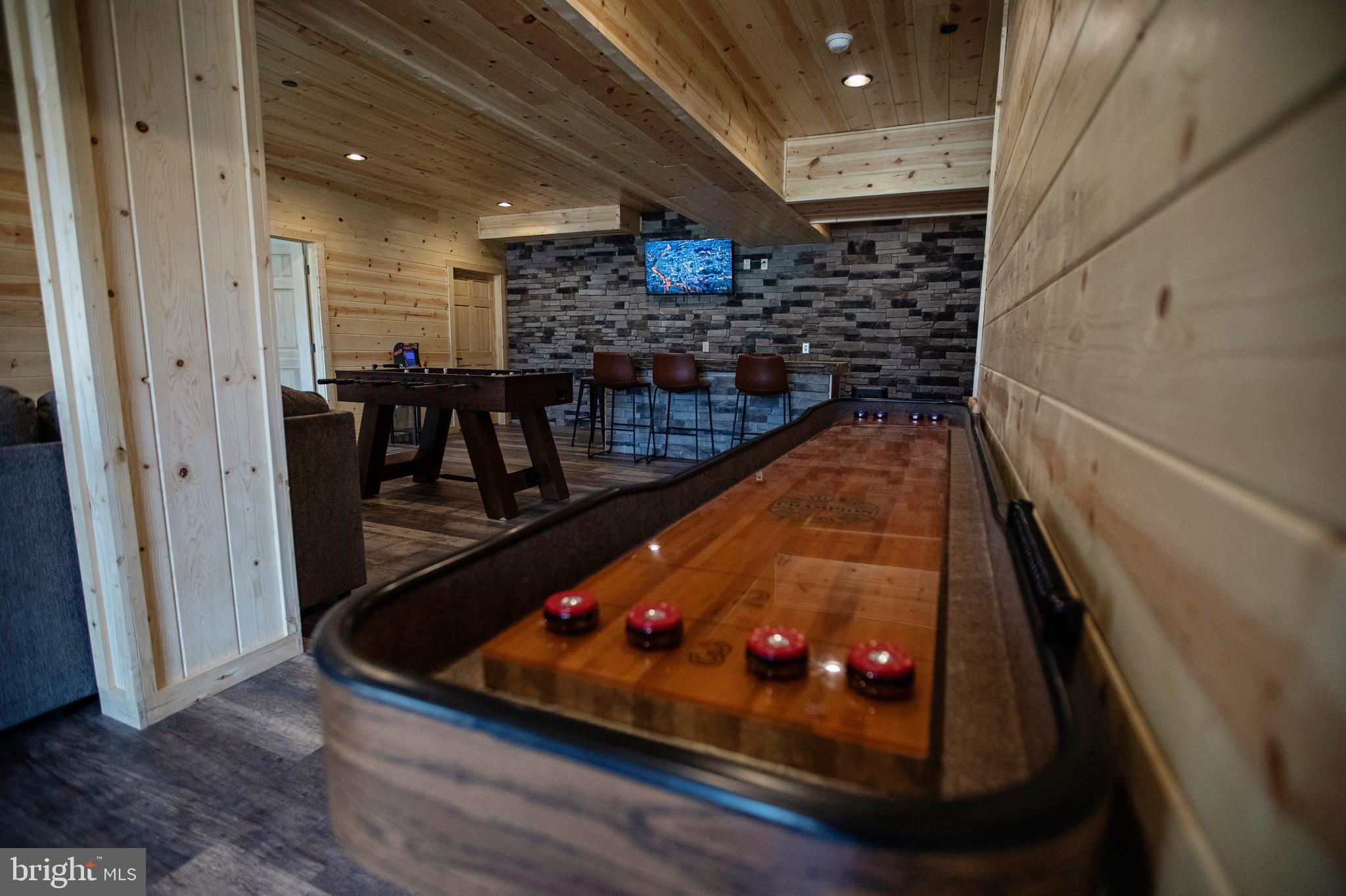 635 Biltmore Rdg Trail McHenry, MD 21541 - Photo 36 of 64 a room with lots of frames on wall and wooden floor